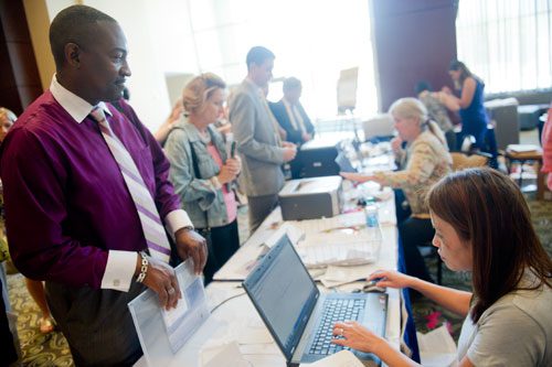 Nevada Assemblyman Tyrone Thompson (left) registers with Nang Loong for the 2013 National Conference of State Legislators at the Omni Hotel in Atlanta on Sunday, August 11, 2013. 5,000 attendees are expected at the conderence this year including around 1,000 state legislators from all over the nation.