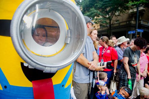 Dressed as a minion from the movie Despicable Me, Melina Le waits for the  annual DragonCon parade through downtown Atlanta on Saturday, August 31, 2013. 