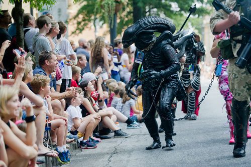 Dressed as alien, Samantha Watters marches in the annual DragonCon parade through downtown Atlanta on Saturday, August 31, 2013.