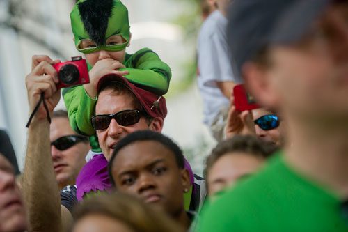 Cullen Hill sits on his father David's shoulders as they watch the annual DragonCon parade through downtown Atlanta on Saturday, August 31, 2013. 