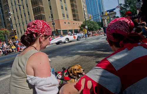 Cassidy Fishman (left) and Joe Gresham watch the annual DragonCon parade through downtown Atlanta on Saturday, August 31, 2013. 