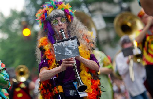 Karen Parker plays the clarinet as she marches in the annual DragonCon parade through downtown Atlanta on Saturday, August 31, 2013.