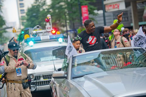 Ernie Hudson (right) waves to the crowd as he makes his way down Peachtree Street in the annual DragonCon parade through downtown Atlanta on Saturday, August 31, 2013. 