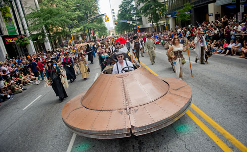 John Kascak (center) drives a float in the annual DragonCon parade through downtown Atlanta on Saturday, August 31, 2013. 