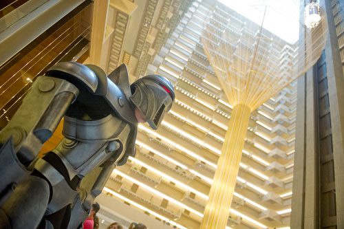 Dressed as a Cylon, Kendall Bailey poses for photos in the lobby of the Hyatt  Regency hotel during DragonCon in downtown Atlanta on Saturday, August 31, 2013. 