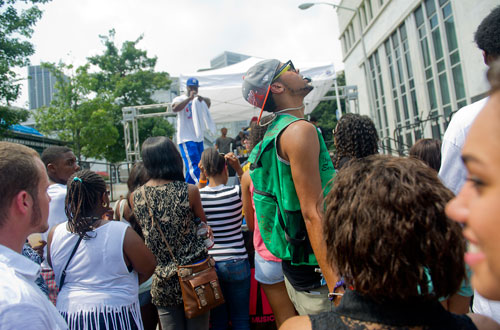 Da'Shawn McKinnon (center) dances in the crowd at Georgia State University in Atlanta during the LudaDay Weekend Block Party on Saturday, August 31, 2013. 