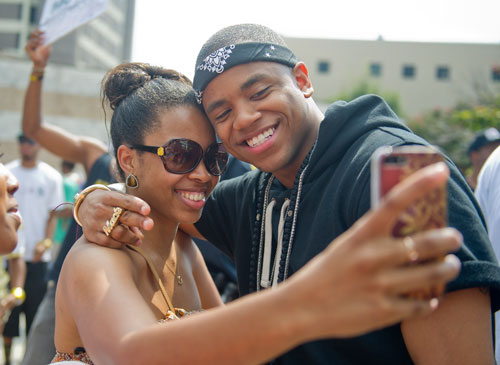 Mack Wilds (right) poses for a photo with Kenya Mathias before he takes the stage at Georgia State University in Atlanta during the LudaDay Weekend Block Party on Saturday, August 31, 2013.  