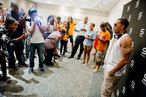 Christopher Brian Bridges, better known by his stage name Ludacris, (right) talks to members of the media at Georgia State University in Atlanta during the LudaDay Weekend Block Party on Saturday, August 31, 2013. 