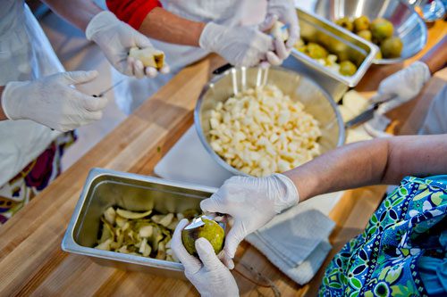 Lucia Smeal (bottom), Kristin Stockton, Dawn Nelson and Morgan Dooley cut up pears during a canning class at The Preserving Place in Atlanta on Saturday, September 14, 2013.