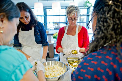 Kristin Stockton (left) and Dawn Nelson cut up pears during a canning class at The Preserving Place in Atlanta on Saturday, September 14, 2013. 
