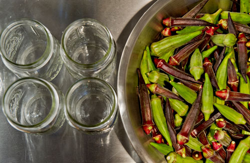 A bowl of okra sits next to empty mason jars at The Preserving Place in Atlanta on Saturday, September 14, 2013. 