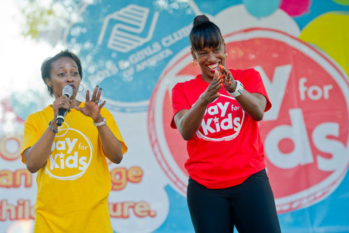 Gail Devers (left) and Jackie Joyner-Kersee take the stage during the Boys & Girls Clubs of America's Day for Kids at Piedmont Park in Atlanta on Saturday, September 7, 2013. 