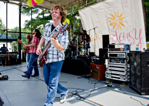 John Ballard (center), Nathan Morgan and Brian Cameron from the band Reluctant Saints perform on stage during the Yellow Daisy Festival at Stone Mountain Park on Saturday, September 7, 2013. 