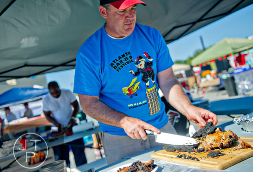 Richard Hall (right) and Richard Slaton with the Blurred Lines team work on their entries before taking them to the judges during the Atlanta Bar-B-Q Festival in Midtown on Saturday, September 14, 2013.