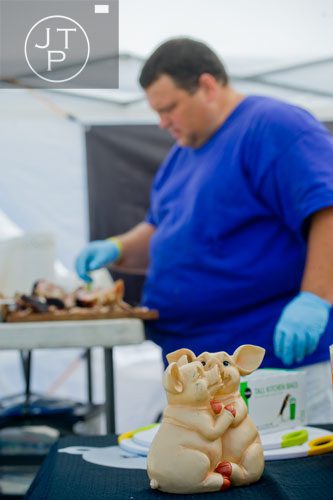 Will Renfron works on his pulled pork before taking it to the judges during the Atlanta Bar-B-Q Festival in Midtown on Saturday, September 14, 2013.