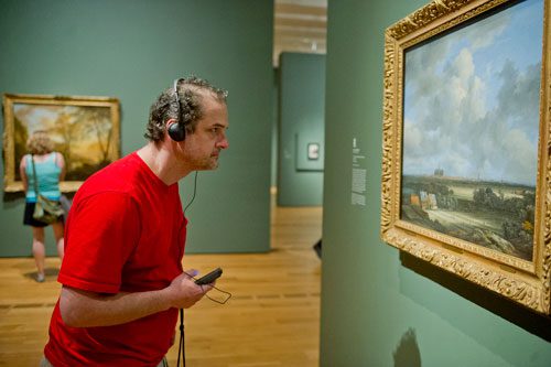 Austin Collins leans in to take a closer look at a painting by Jacob van Ruisdael as he walks through the High Museum of Art in the Midtown neighborhood of Atlanta on Thursday, August 29, 2013. 