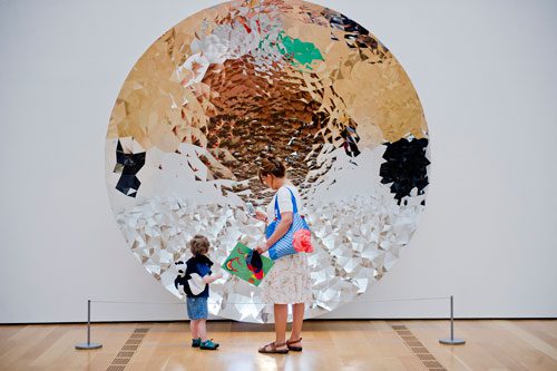 Miki Slifkin (left) and Maria Garcia look at an untitled piece by Anish Kapoor as they walk through the High Museum of Art in the Midtown neighborhood of Atlanta on Thursday, August 29, 2013. 