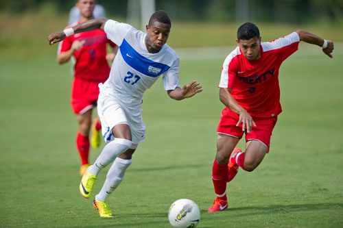 Georgia State's Andy Anglade (27) competes with Liberty's Henry Reyes Jr. for control of the ball during their game on Friday, August 30, 2013.