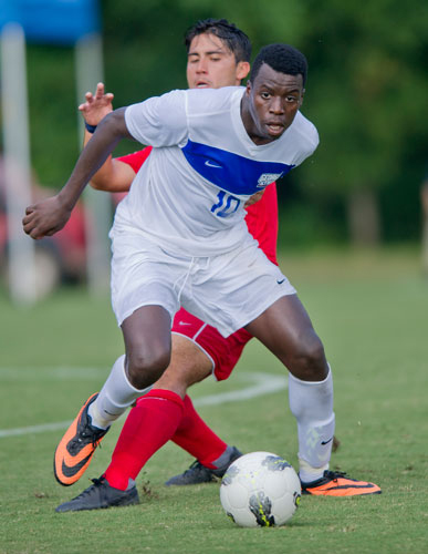 Georgia State's Jamal Keene (10) keeps possession of the ball from Liberty's Jonatan Torres on Friday, August 30, 2013.