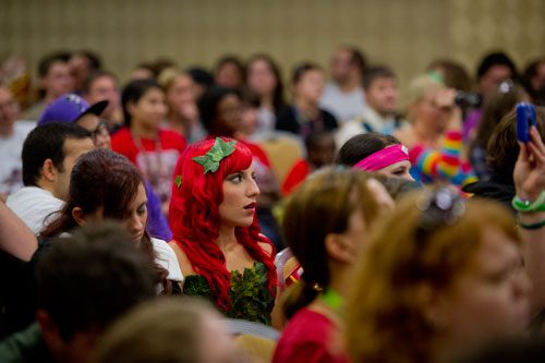 Dressed as Poison Ivy, Taylor Bothwell watches the Incredible Transformations seminar featuring contestants on the SyFy Channel's FaceOff reality television series during DragonCon in downtown Atlanta on Saturday, August 31, 2013.