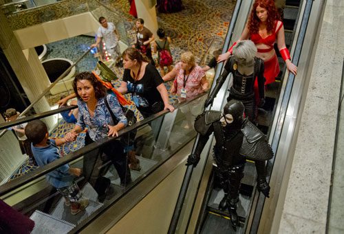 DragonCon attendees in downtown Atlanta ride the escalator in the Marriott Marquis hotel on Saturday, August 31, 2013.