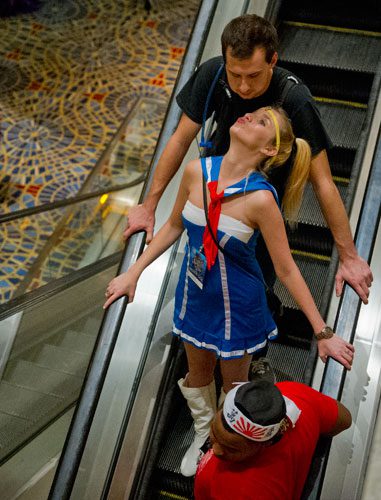 DragonCon attendees in downtown Atlanta ride the escalator in the Marriott Marquis on Saturday, August 31, 2013.
