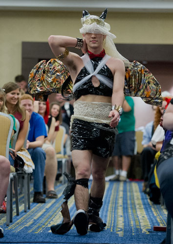 Drew Mergenthaler struts his stuff down the runway during Project Cosplay, one of the numerous seminars at DragonCon in downtown Atlanta on Saturday, August 31, 2013.
