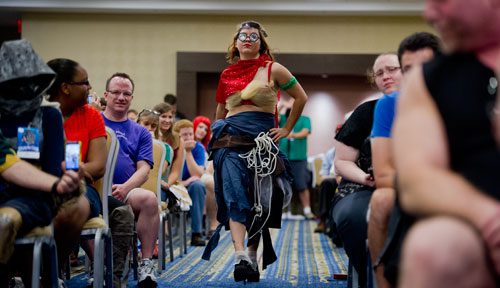 Savannah Hoover struts her stuff down the runway during Project Cosplay, one of the numerous seminars at DragonCon in downtown Atlanta on Saturday, August 31, 2013.