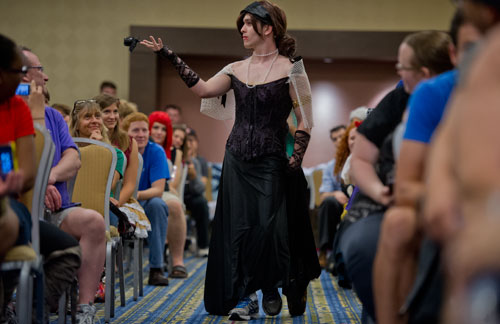 Alex Lindsay struts his stuff down the runway during Project Cosplay, one of the numerous seminars at DragonCon in downtown Atlanta on Saturday, August 31, 2013.