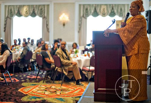 Elisabeth Omilami speaks to guests during the first annual Fowler Family Celebration of Love at Villa Christina in Atlanta on Sunday, September 15, 2013. 