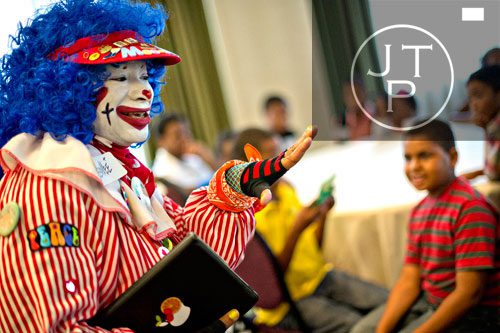 Dressed as MeeMee the Clown, Kathy Lawson entertains over 30 children during the first annual Fowler Family Celebration of Love at Villa Christina in Atlanta on Sunday, September 15, 2013. 