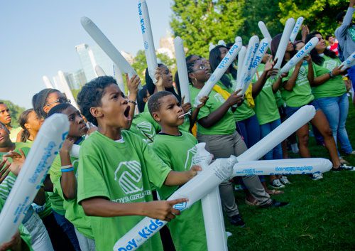 Kobe Jackson (left) and Darren Harrell cheer with hundreds of others during the Boys & Girls Clubs of America's Day for Kids at Piedmont Park in Atlanta on Saturday, September 7, 2013. 