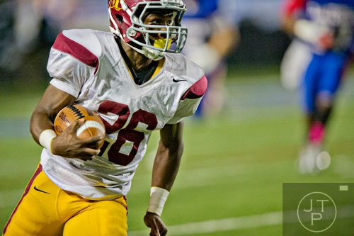 Lassiter's Oris Lawhorn (26) runs the ball down the field to score a touchdown during their game against Walton on Friday, October 4, 2013. 