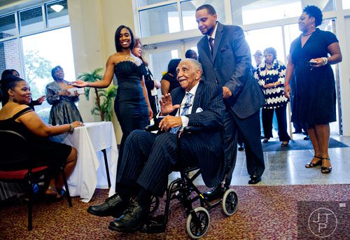 Rev. Dr. Joseph E. Lowery (center) waves as he makes his way to the red carpet for his 92nd Birthday Celebration at Morehouse College in Atlanta on Sunday, October 6, 2013. 