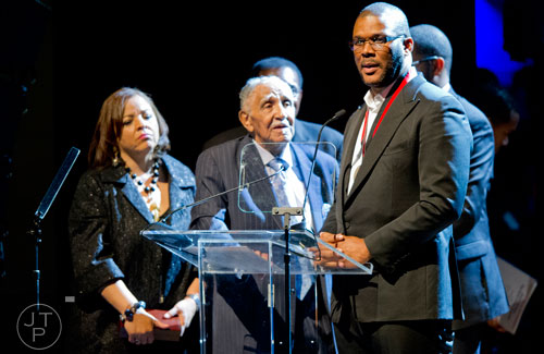 Tyler Perry (right) stands next to Rev. Dr. Joseph E. Lowery as Perry accepts the inaugural Joseph E. Lowery Agent of Change Award during I've Known Rivers: A Legendary Life, a tribute to Lowery's 92nd birthday at Morehouse College in Atlanta on Sunday, October 6, 2013.