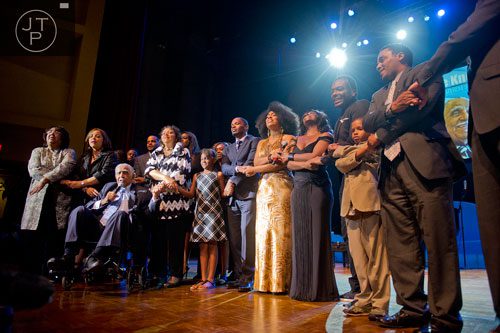 Rev. Dr. Joseph E. Lowery (left seated)  is surrounded by friends and family as they sing "We Shall Overcome" on stage  during I've Known Rivers: A Legendary Life, a tribute to Lowery's 92nd birthday at Morehouse College in Atlanta on Sunday, October 6, 2013.