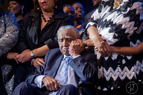 Rev. Dr. Joseph E. Lowery (center)  is surrounded by friends and family as they sing "We Shall Overcome" on stage  during I've Known Rivers: A Legendary Life, a tribute to Lowery's 92nd birthday at Morehouse College in Atlanta on Sunday, October 6, 2013. 