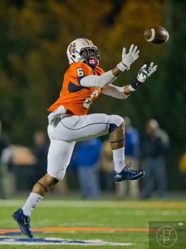 North Cobb's J'Vonte Herrod (6) leaps into the air trying to catch the ball which ended in an interception by McEachern on Friday, October 18, 2013. 