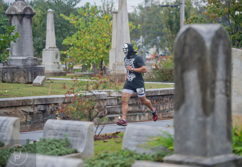 Nick Gallegos runs through Oakland Cemetery in Atlanta during the 2013 Run Like Hell 5k on Saturday, October 19, 2013. 