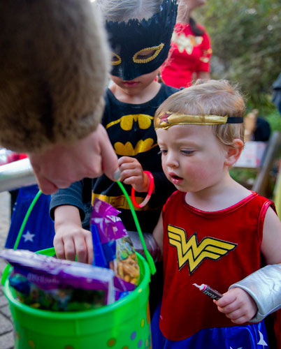 Grace Anne Roberts (right) and Bella Lotz pick out pieces of candy before taking a Halloween Hike at the Chattahoochee Nature Center in Roswell on Saturday, October 19, 2013.
