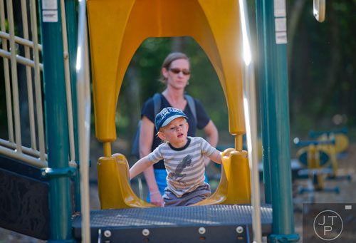 Damien Duff climbs a slide as his aunt Julie Kerr watches during Parktoberfest at Whittier Mill Park in Atlanta on Saturday, October 12, 2013.