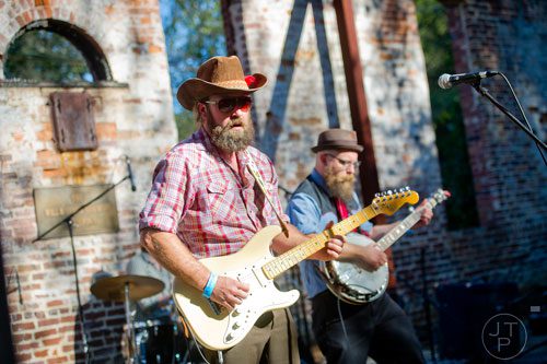 Jess Hopkins (left) and Christopher Salmon from the band Rolling Nowhere perform on stage during Parktoberfest at Whittier Mill Park in Atlanta on Saturday, October 12, 2013. 
