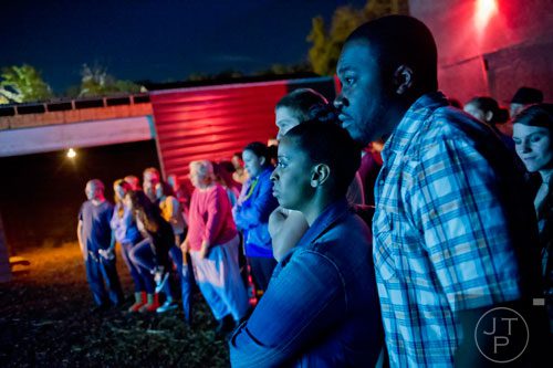 Demar Smith (right) and his wife Mia watch a scene in Hell's Gates at Lighthouse Baptist Church in Dawsonville on Thursday, October 17, 2013.