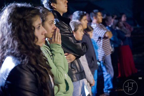 Alejandra Delatorre holds her hands to her face as she watches a scene in Hell's Gates at Lighthouse Baptist Church in Dawsonville on Thursday, October 17, 2013.