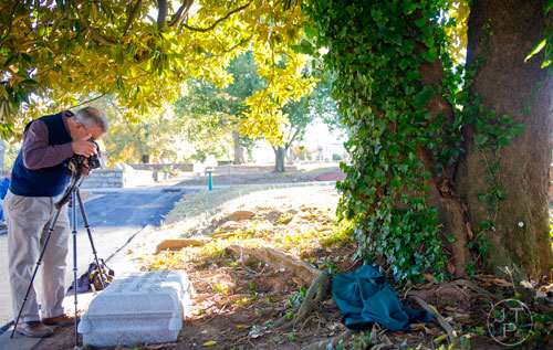 Ren Davis takes a photo of Abbie Howard's tombstone before a small dedication ceremony for her at Oakland Cemetery in Atlanta on Sunday, November 3, 2013. Donations were gathered from patrons during the cemetery's 2012 Halloween tours to raise funds for a gravestone for Howard, who according to some historians was the inspiration for the character Belle Watling in Margaret Mitchell's "Gone with the Wind". 