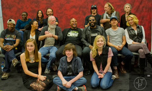 The cast of The Walking Dead pose for a "family photo" during Walker Stalker Con at the Atlanta Convention Center at AmericasMart on Saturday, November 2, 2013. 