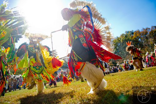 Josh Mowatt (center) dances during the Indian Festival & Pow-Wow at Stone Mountain Park on Sunday, November 3, 2013. 