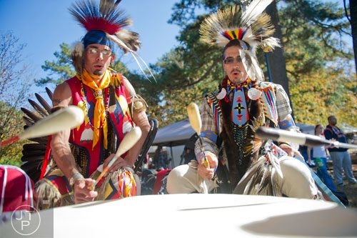 Members of the Silverridge Drum Circle Joe Delgadillo (left) and Adam Wright play during the Indian Festival & Pow-Wow at Stone Mountain Park on Sunday, November 3, 2013. 