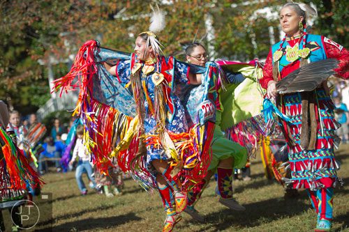 Tiffany Jolly (center) dances during the Indian Festival & Pow-Wow at Stone Mountain Park on Sunday, November 3, 2013. 