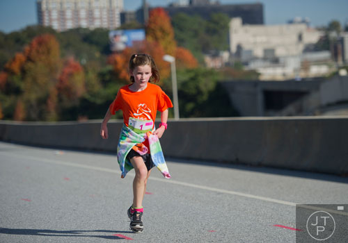 Claire Tharpe runs during the 2013 Girls on the Run 5k at Atlantic Station in Atlanta on Sunday, November 10, 2013. 